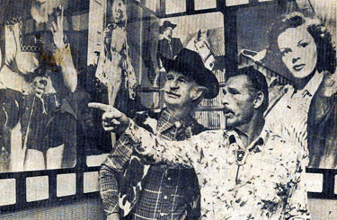 Buster Crabbe guides Slim Andrews to a photo of Buster as Flash Gordon during a visit to Harlow’s Restaurant in Memphis, TN. The two cowboys were in Memphis for an early film festival. (Thanx to Billy Holcomb.)