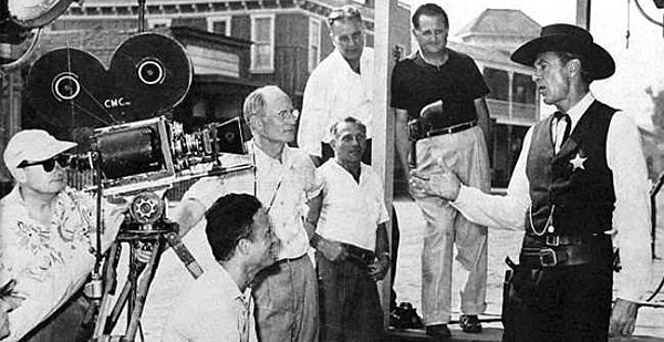 Gary Cooper talks with crew members while making “High Noon” (‘52 U.A.). 