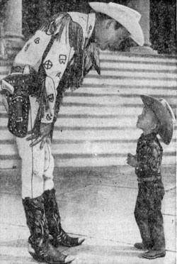 ...on the other hand, Roy Rogers has to bend down to say hello to a young admirer while Roy was appearing at the Madison Square Garden Rodeo in March 1959.