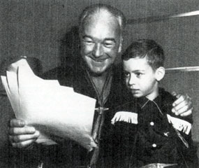 Hopalong Cassidy shows a young fan the script for his next radio broadcast.