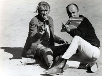 While making “Firecreek” (‘68 Warner Bros.) in Sedona, AZ, James Stewart takes a few pointers from director Vincent McEveety.