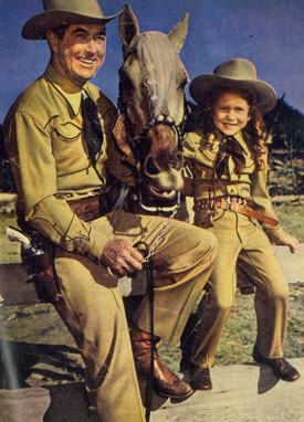 Monogram B-Western star Johnny Mack Brown with his cowgirl daughter Cynthia.