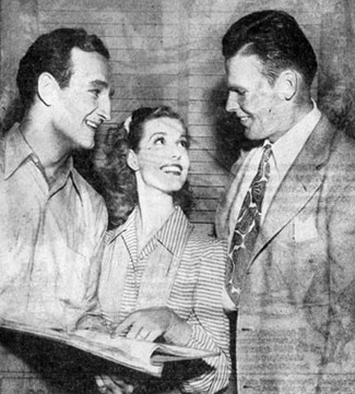 Tom Harmon and John Kimbrough, team mates on the mythical All-America Football Team, meet on August 26, 1941 at Columbia Studios where Harmon was filming “Harmon of Michigan” (‘41) co-starring Anita Louise (center). Kimbrough starred in “Sundown Jim” and “Lone Star Ranger” (both ‘42) at 20th Century Fox.