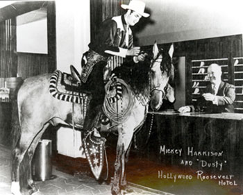 Before he became Sunset Carson, Mickey Harrison rode a horse named Dusty into the lobby of the Hollywood Roosevelt Hotel in L.A. for a publicity shot.