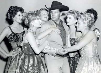 Dale Robertson as Wells Fargo agent Jim Hardie tangles with a bevy of dancehall girls in the 1960 episode “The Governor’s Visit”. (L-R) Mari Blanchard, Joan Staley, Mari Lynn, Joan Granville, Helen Stern and (partly hidden) Kristina Hansen. 