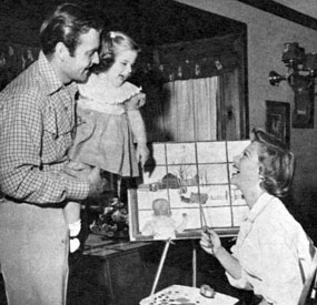 George Montgomery with five year old daughter Missy and wife Dinah Shore in 1952.