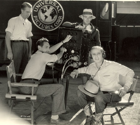 Two behind the scenes pics of Hoot Gibson as he checks out the sound recording on his early 1929 Universal sound westerns.