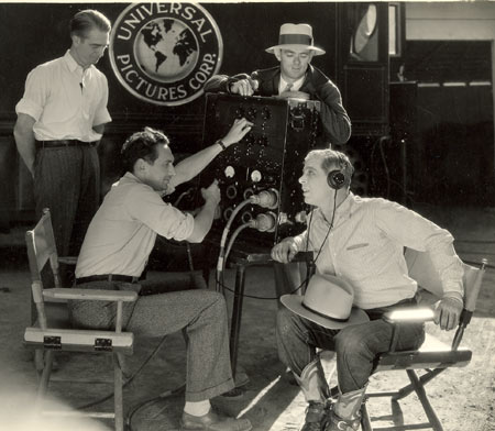 Two behind the scenes pics of Hoot Gibson as he checks out the sound recording on his early 1929 Universal sound westerns.