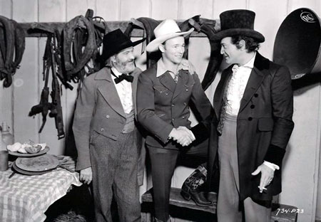 Gabby Hayes introduces Roy Rogers to Richard Dix on the set of "Man of Conquest" in which Dix played Sam Houston. Hayes had a character role in the big budget Republic feature which was released in 1939. (Thanx to Bobby Copeland.)