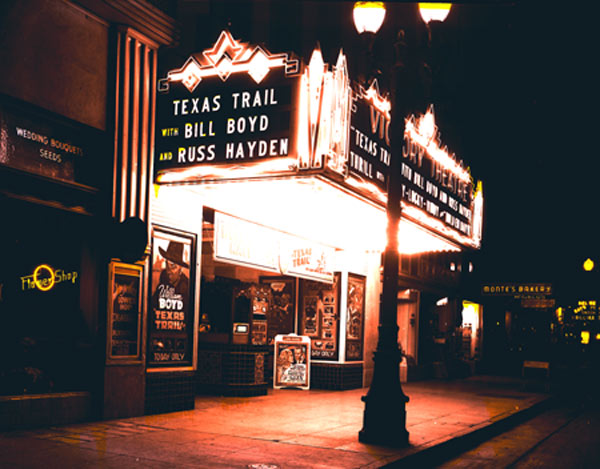 Nostalgia! Here's the way we used to enjoy going to the movies. Two shots of the Victory Theatre (anybody know in what town this theatre might have been?) in 1941 showing a double feature of Hoppy's "Texas Trail" (in re-release) and "Hold 'Em Navy" with Abbott and Costello. Notice the poster to the right of the boxoffice shows "Wells Fargo" with Joel McCrea as coming soon.