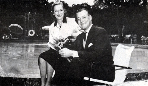 Charles Starrett and wife Mary relax beside their pool.