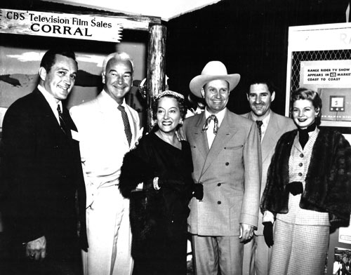 Publicity photo for syndication of various TV shows in the mid ‘50s. (L-R) Don Haggerty (“Cases of Eddie Drake”/“Cases of Jeffrey Jones”), William Boyd (“Hopalong Cassidy”), Gloria Swanson (“Gloria Swanson Presents”), Gene Autry and Pat Buttram (“The Gene Autry Show”), Gail Davis (“Annie Oakley”). Note the “Range Rider” promo on the wall. (Photo courtesy Dale Price.)