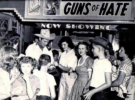 What a day this must have been in Mangum, OK, in August 1948! RKO's Tim Holt was in Mangum for a rodeo and parade and stopped off at not just one, but two, theatres both showing "Guns of Hate" ('48). Top photo shows Tim at the Temple Theatre with the bottom photo taken at the Greer Theatre the same day. (Photos courtesy Billy Holcomb.)