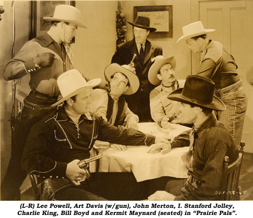 (L-R) Lee Powell, Art Davis (w/gun), John Merton, I. Stanford Jolley, Charlie King, Bill Boyd and Kermit Maynard (seated) in "Prairie Pals".