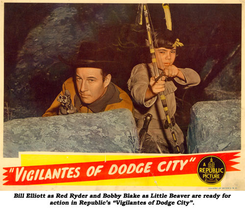 Bill Elliott as Red Ryder and Bobby Blake as Little Beaver are ready for action in Republic's "Vigilantes of Dodge City".