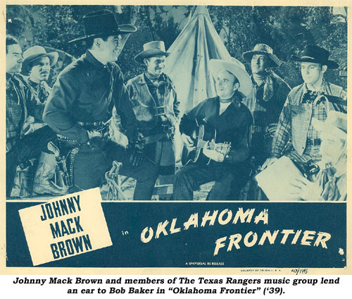 Johnny Mack Brown and members of The Texas Rangers music group lend an ear to Bob Baker in "Oklahoma Frontier" ('39).