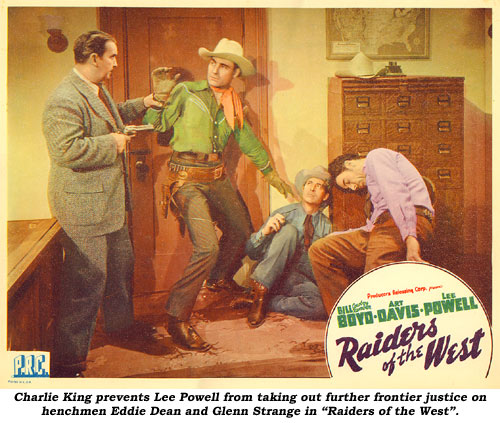 Charlie King prevents Lee Powell from taking out further frontier justice on henchmen Eddie Dean and Glenn Strange in "Raiders of the West".