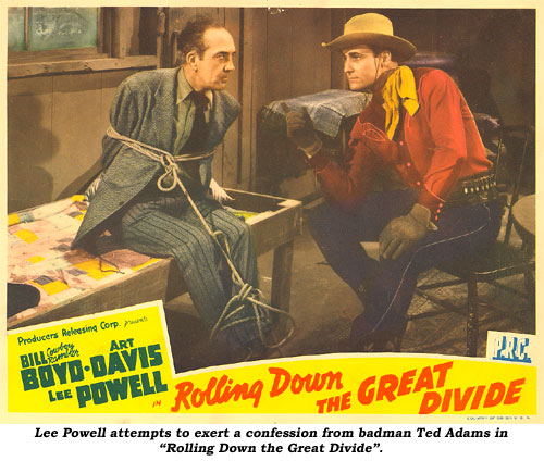 Lee Powell attempts to exert a confession from badman Ted Adams in "Rolling Down the Great Divide".