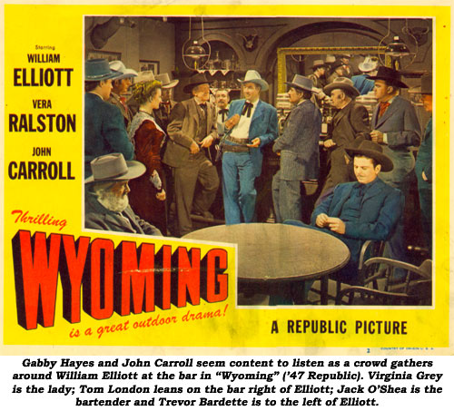 Gabby Hayes and John Carroll seem content to listen as a crowd gathers around William Elliott at the bar in "Wyoming" ('47 Republic). Virginian Grey is the lady; Tom London leans on the bar right of Elliott; Jack O'Shea is the bartneder and Trevor Bardette is to the left of Elliott.