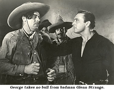 George takes no bull from badman Glenn Strange in "Fighting Gringo" ('39 RKO).