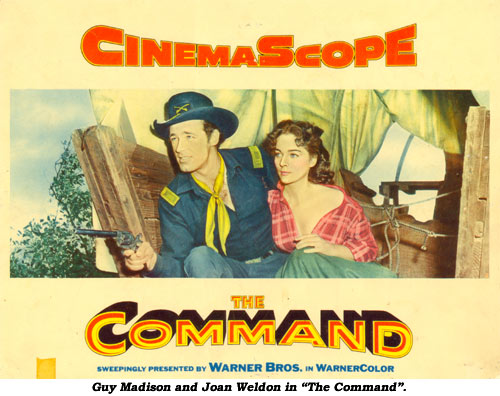Guy Madison and Joan Weldon in "The Command".