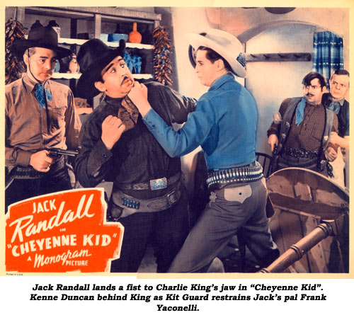 Jack Randall lands a fist to Charlie King's jaw in "Cheyenne Kid". Kenne Duncan behind King as Kit Guard restrains Jack's pal Frank Yaconelli.