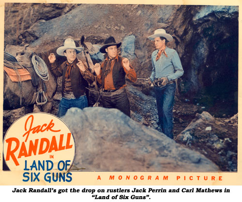 Jack Randall's got the drop on rustlers Jack Perrin and Carl Mathews in "Land of Six Guns".