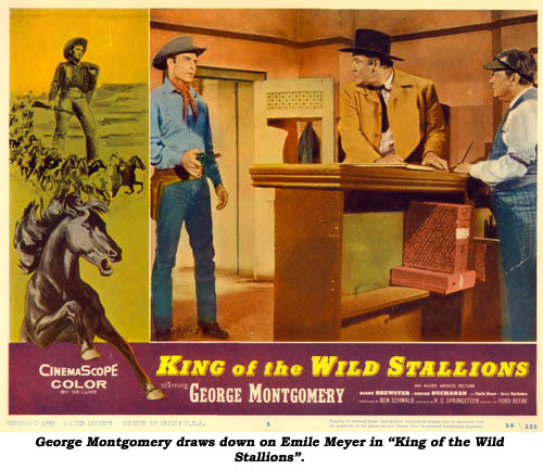 George Montgomery draws down on Emile Meyer in "King of the Wild Stallions".
