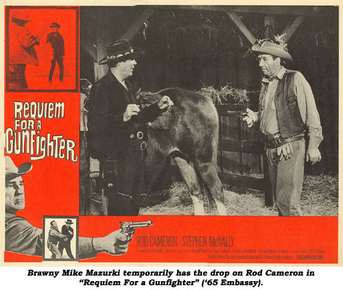 Brawny Mike Mazurki temporarily has the drop on Rod Cameron in "Requim for a Gunfighter" ('65 Embassy).