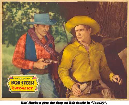 Karl Hackett gets the drop on Bob Steele in "Cavalry".