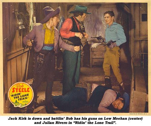 JackKirk is down and battlin' Bob has his guns of Lew Meehan (center) and Julian Rivero in "Ridin' the Lone Trail".