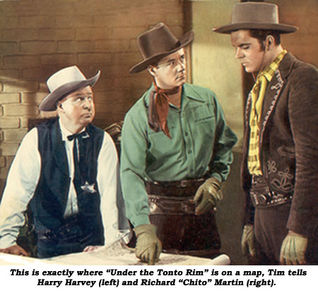 On a map, Tim lets Harry Harvey (left) and Richard "Chito" Martin (right) know exactly where "Under the Tonto Rim" is.