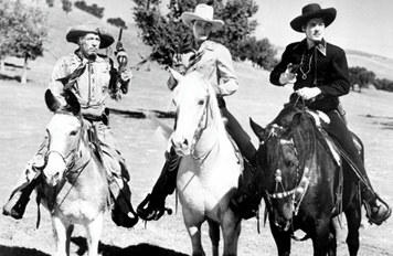 Raymond Hatton, Bob Livingston and Duncan Renaldo on horseback as The Three Mesquiteers.